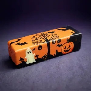 Halloween butter squishy - orange bar with printed ghost, tree and pumpkin scene