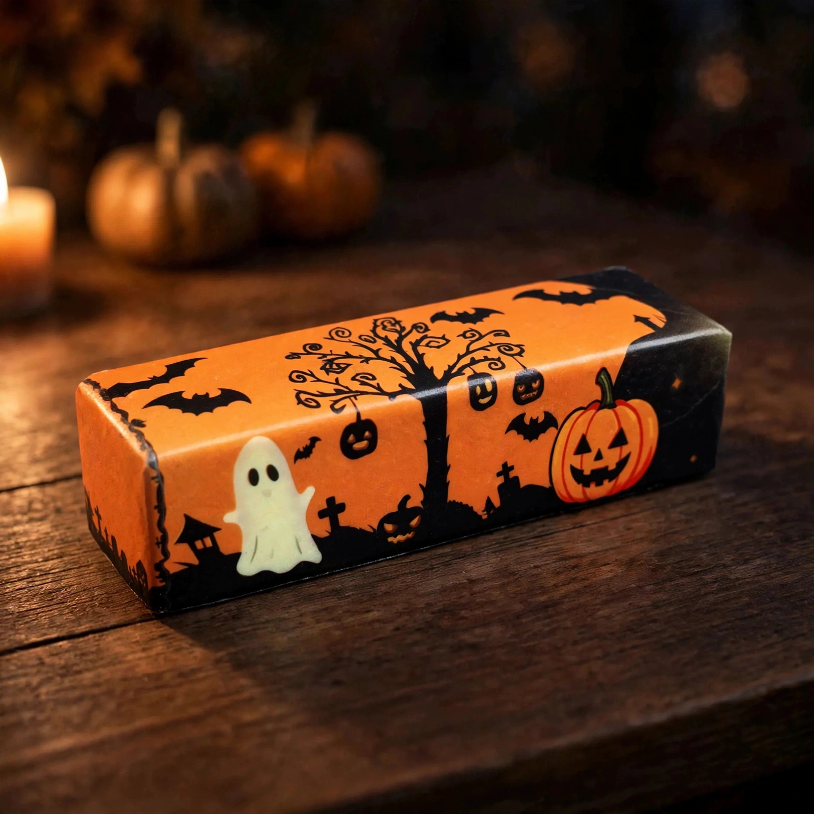 Halloween butter squishy on a dark table by candlelight