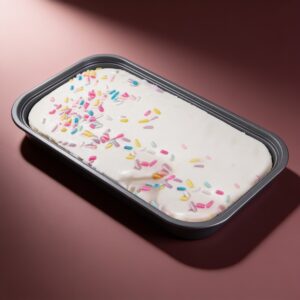 Milk cake squishy in its tray with colorful sprinkles
