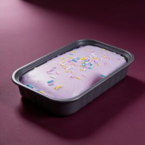 Taro cake squishy in its tray with colorful sprinkles